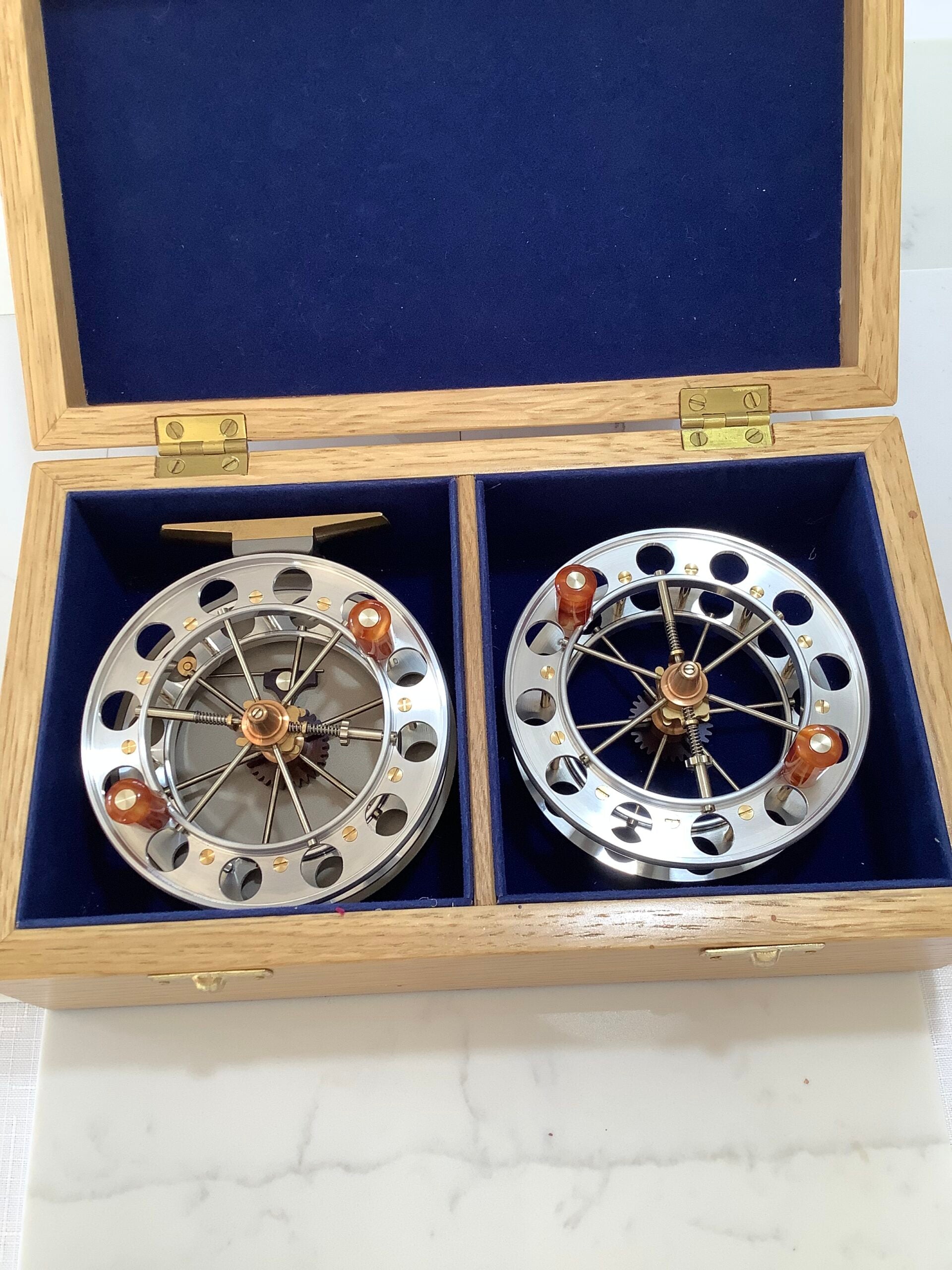 A presentation Boxed CHRIS LYHTE ROACH CENTREPIN WITH SPARE SPOOL