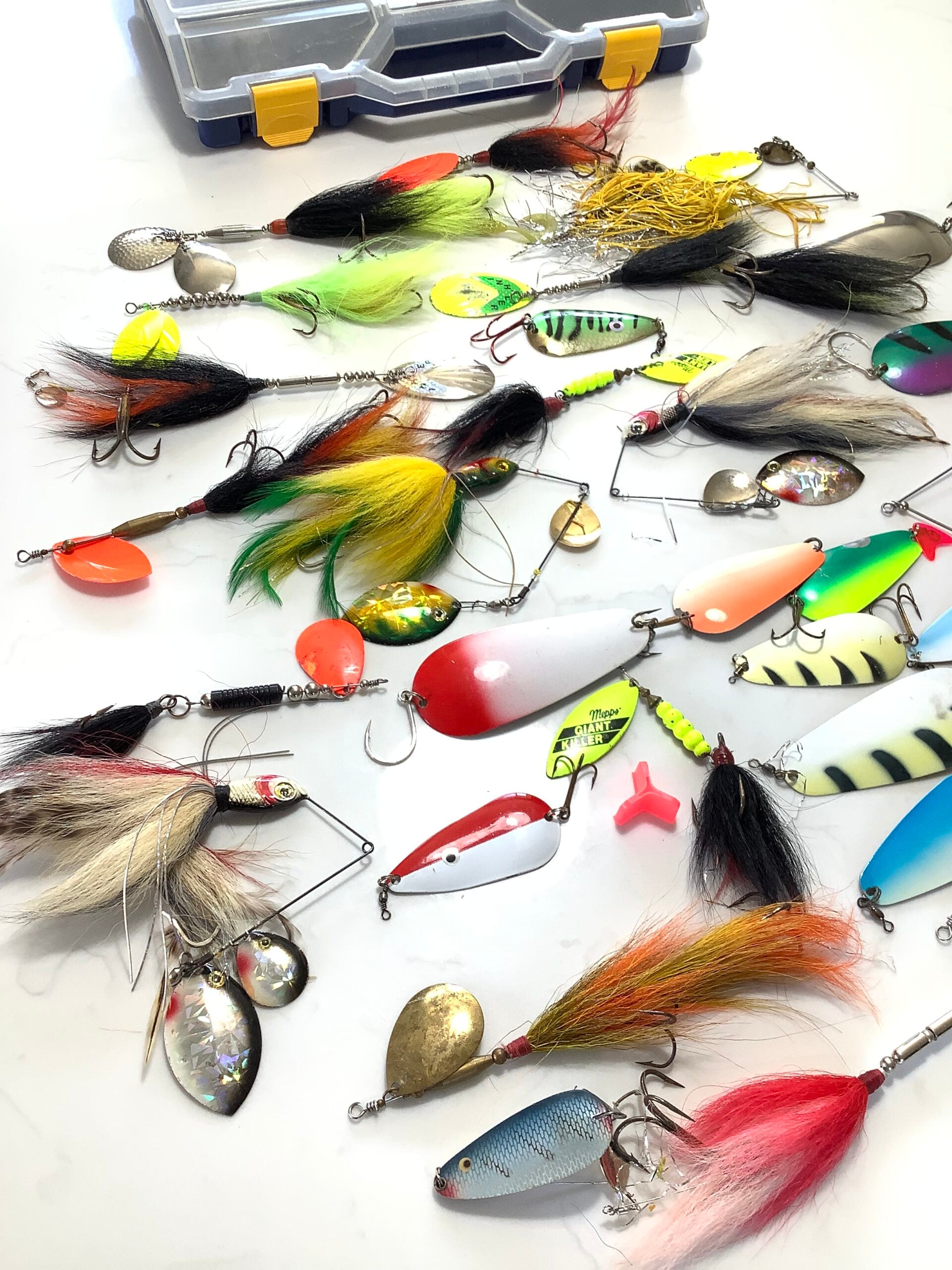 A selection of Large Pike spinners, spinnerbaits and bucktails, spoons, with box.