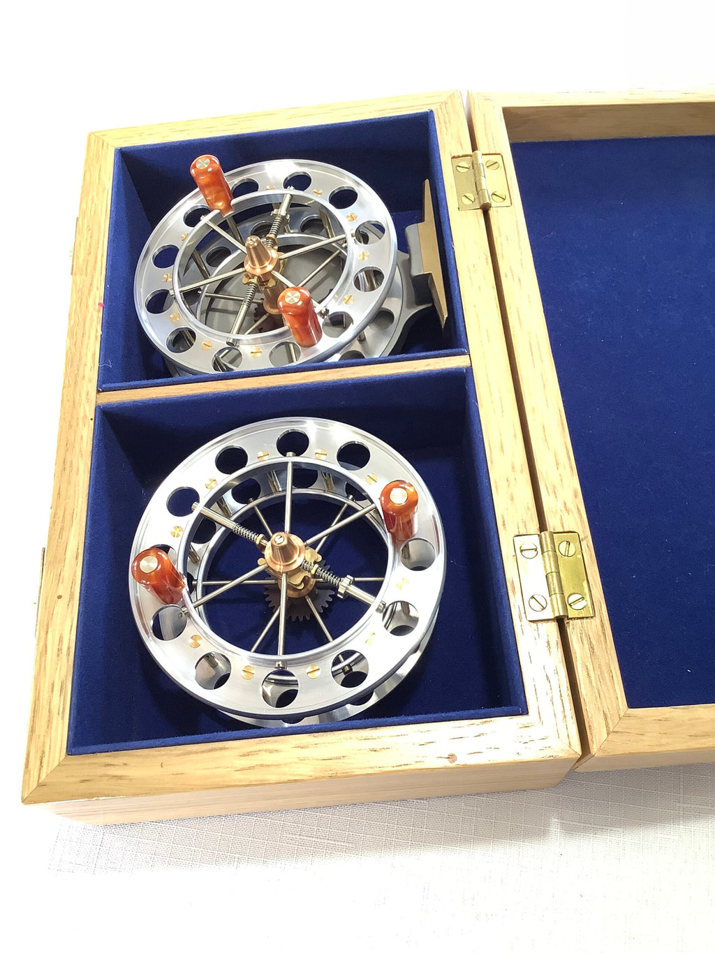 A presentation Boxed CHRIS LYHTE ROACH CENTREPIN WITH SPARE SPOOL