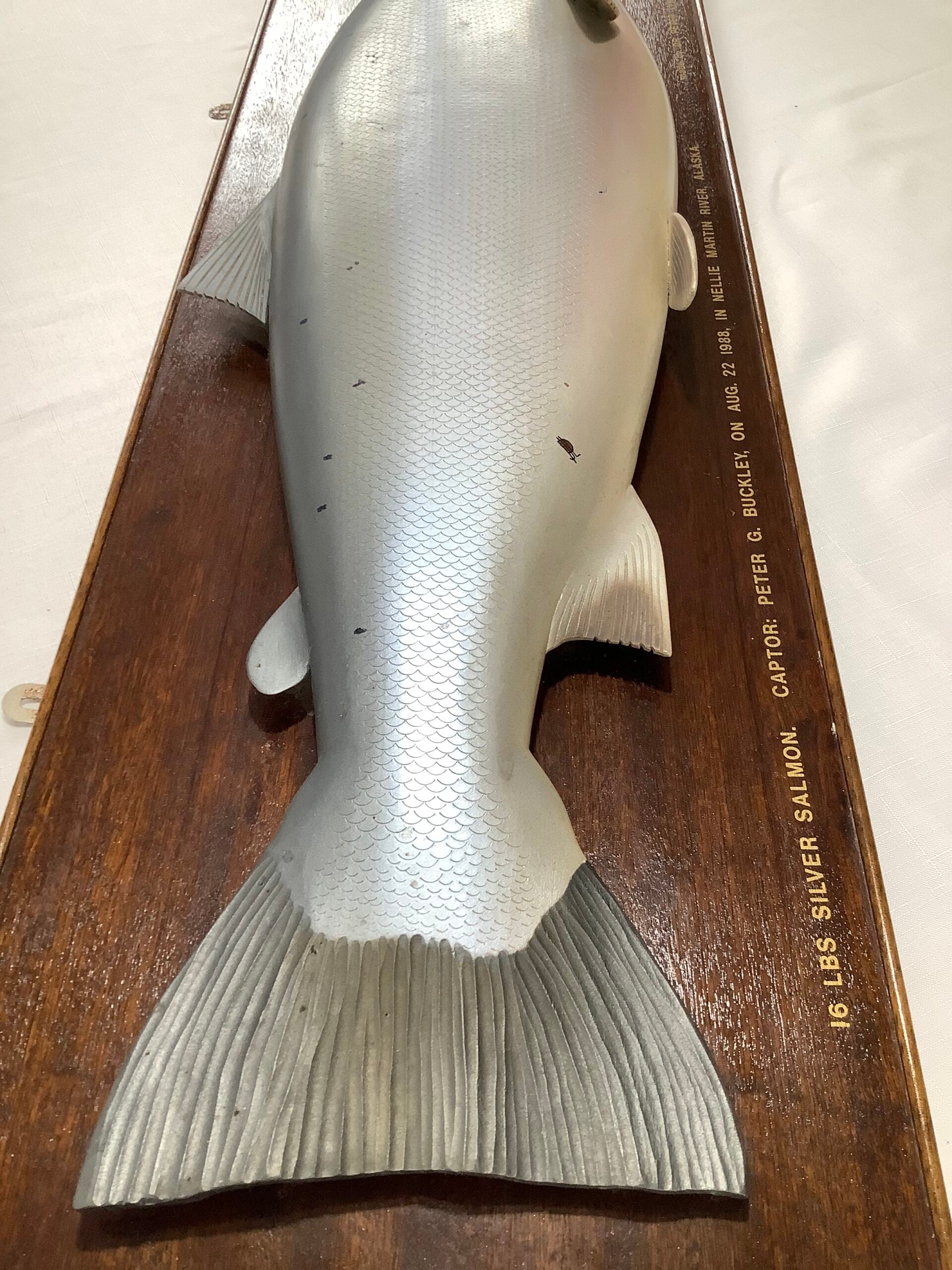 A Half Block Wood Carved Salmon on a Mahogany’s Display Board