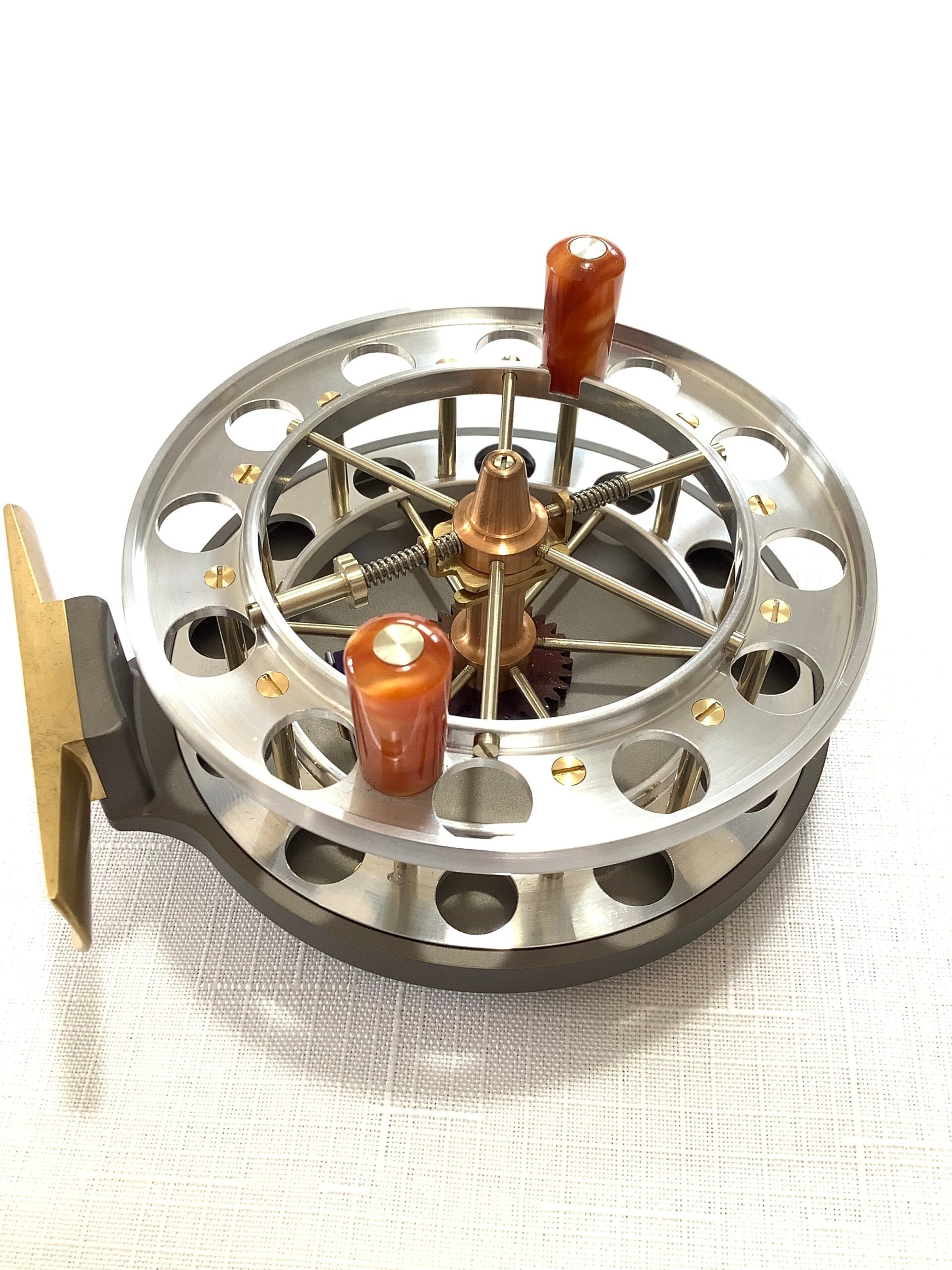 A presentation Boxed CHRIS LYHTE ROACH CENTREPIN WITH SPARE SPOOL