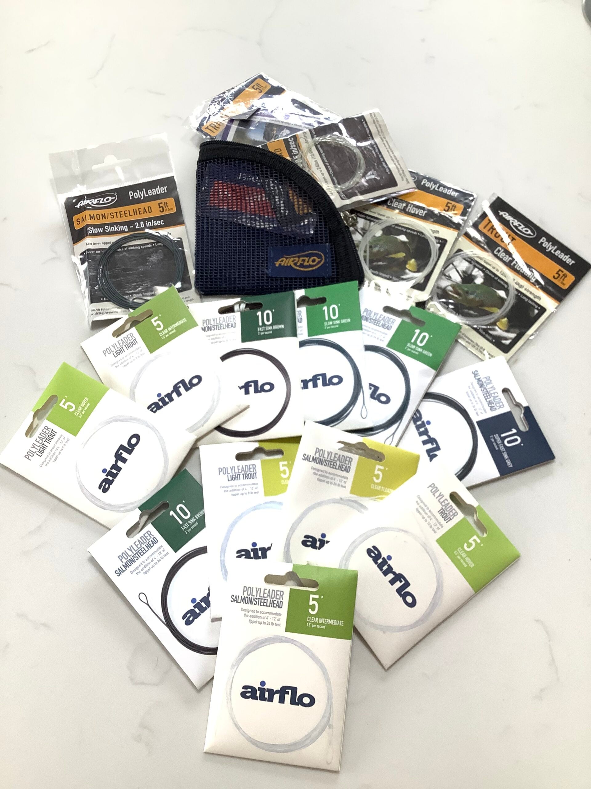 Various New unused AIRFLO Trout Polyleaders and wallet.