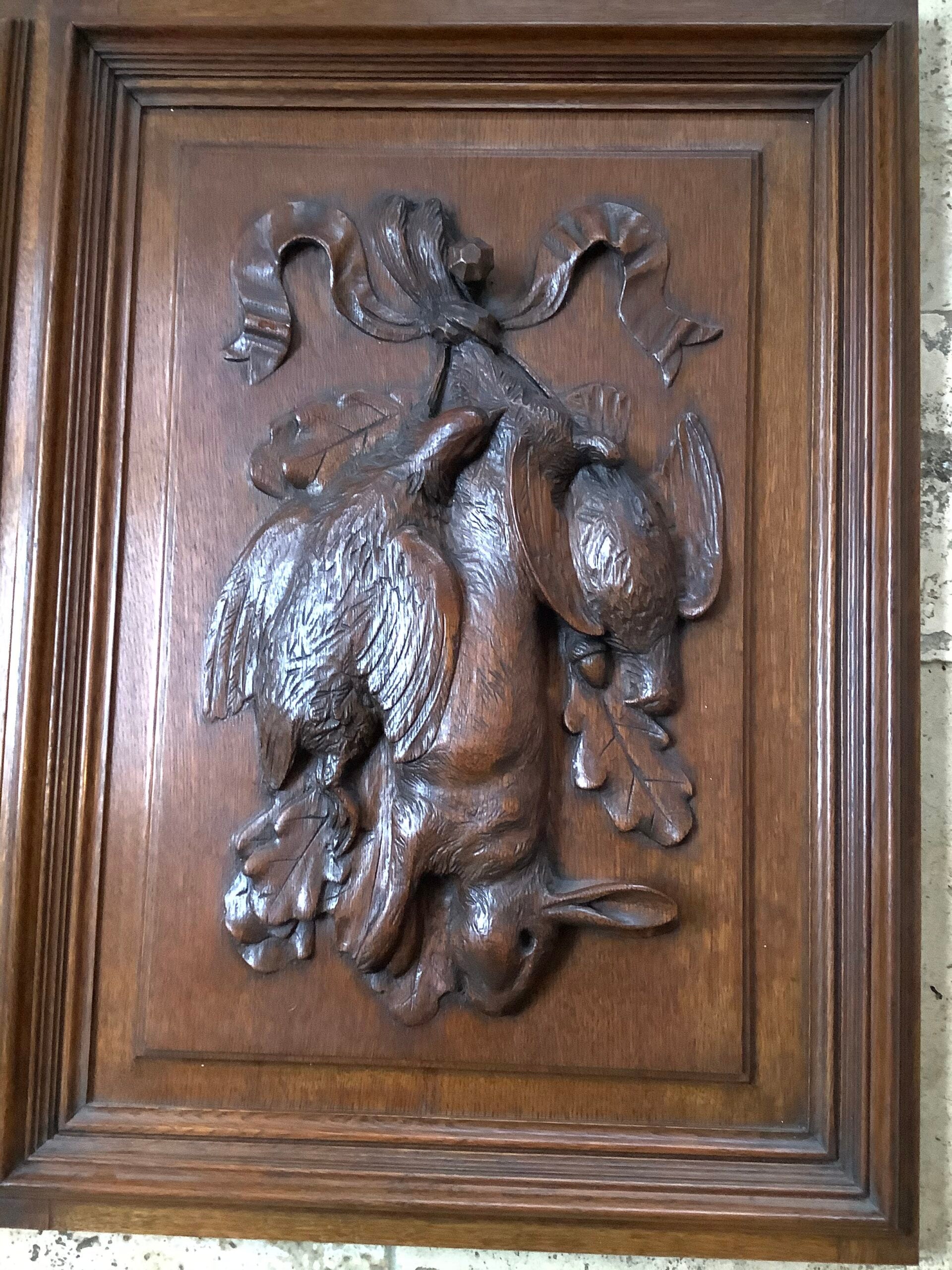 A stunning Antique Handcarved Hunting quarry set on an Oak framed Panel