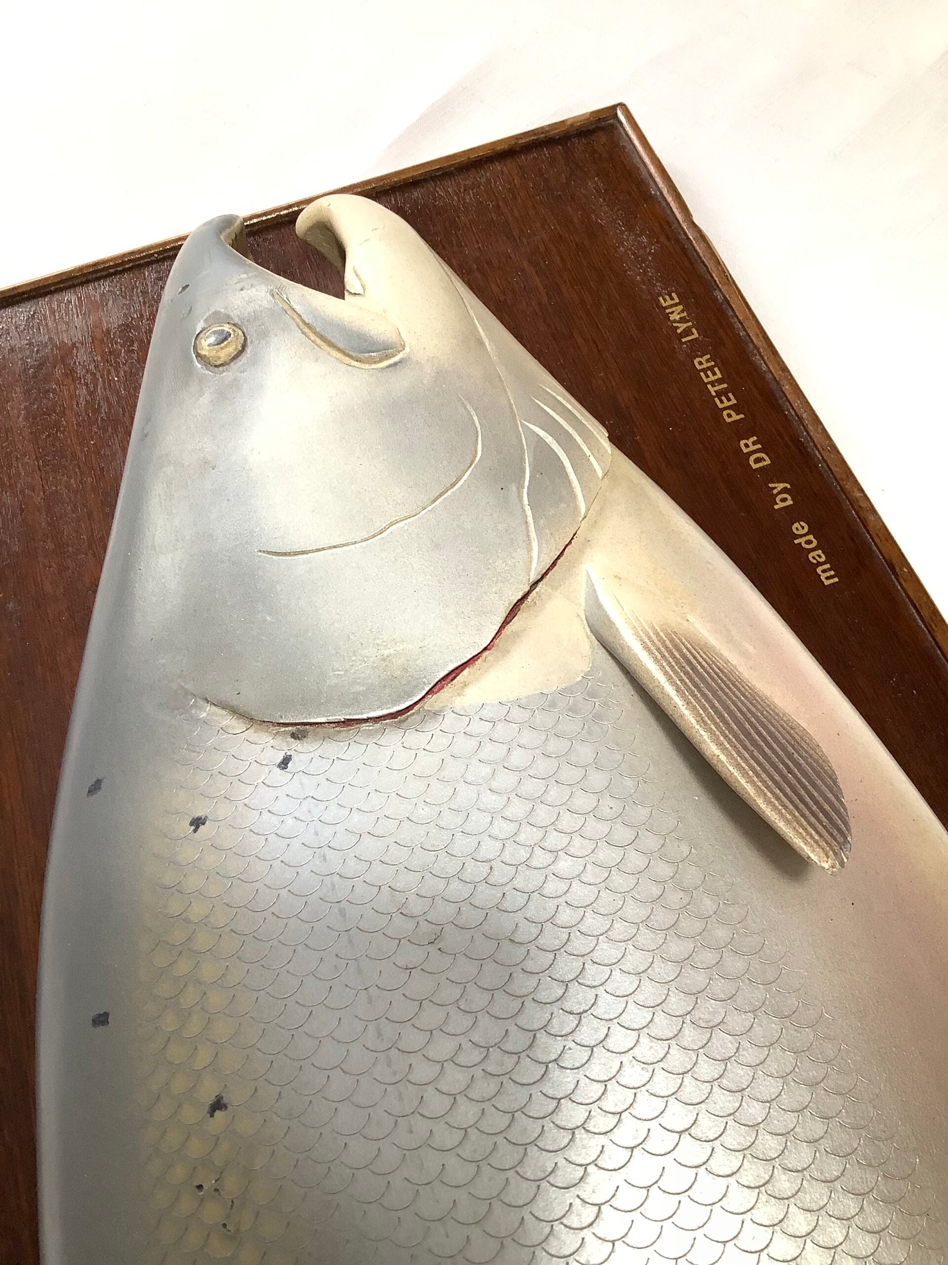 A Half Block Wood Carved Salmon on a Mahogany’s Display Board