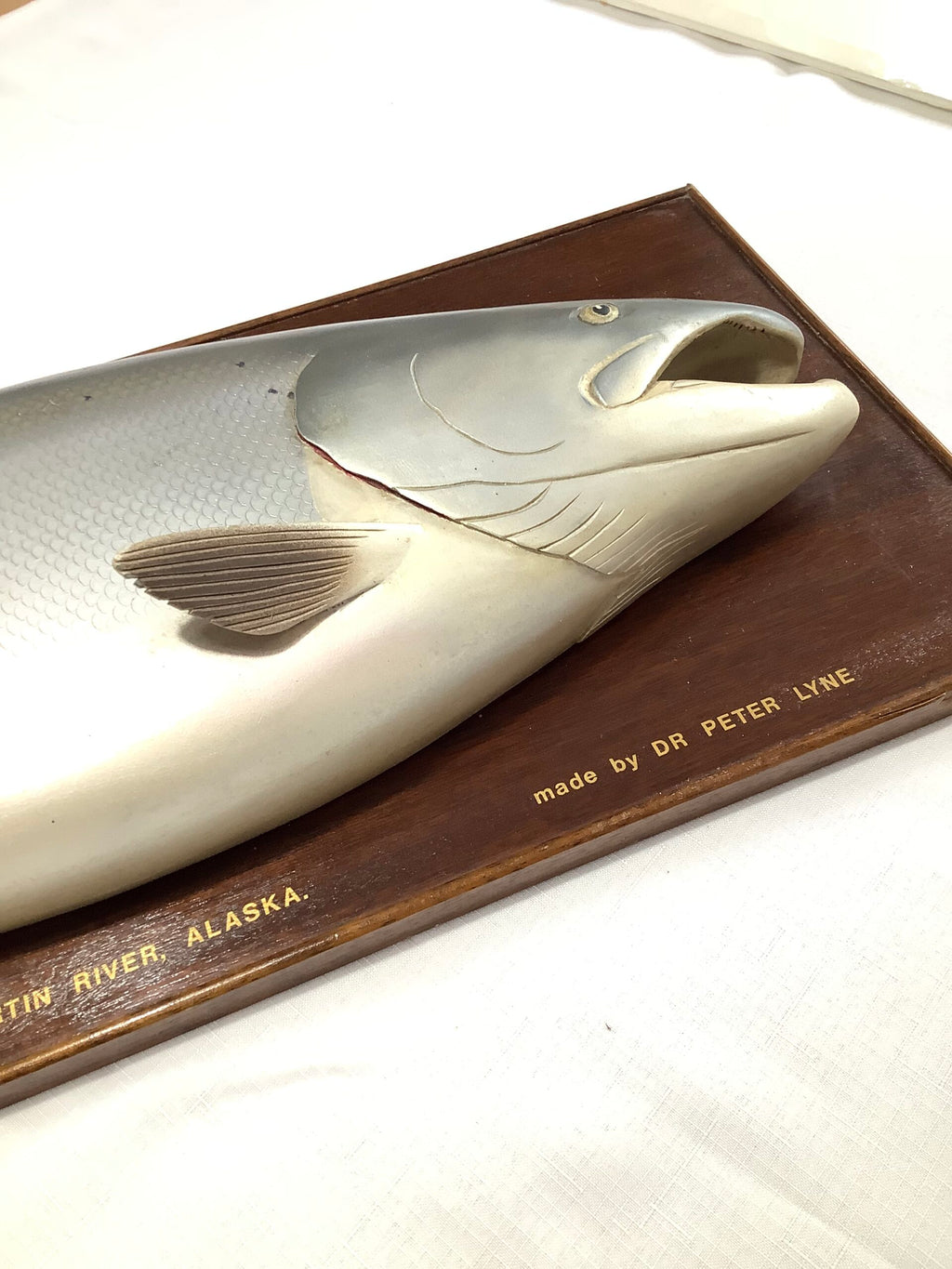 A Half Block Wood Carved Salmon on a Mahogany’s Display Board