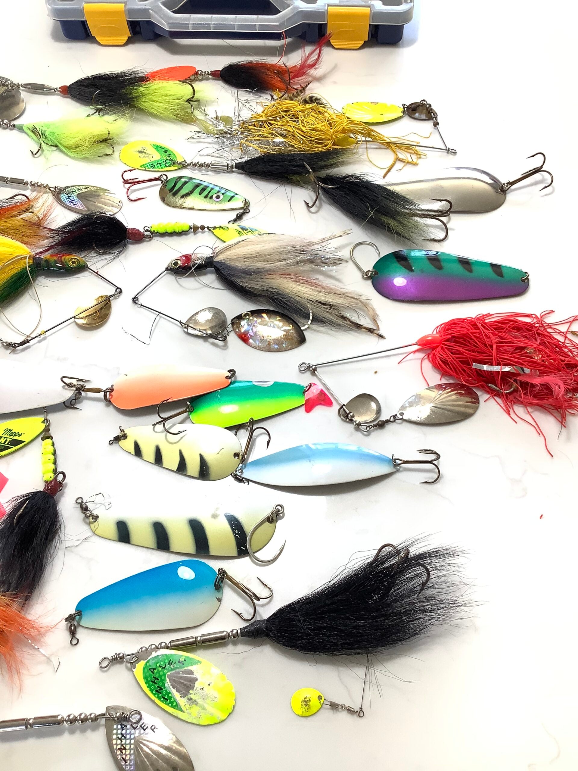 A selection of Large Pike spinners, spinnerbaits and bucktails, spoons, with box.