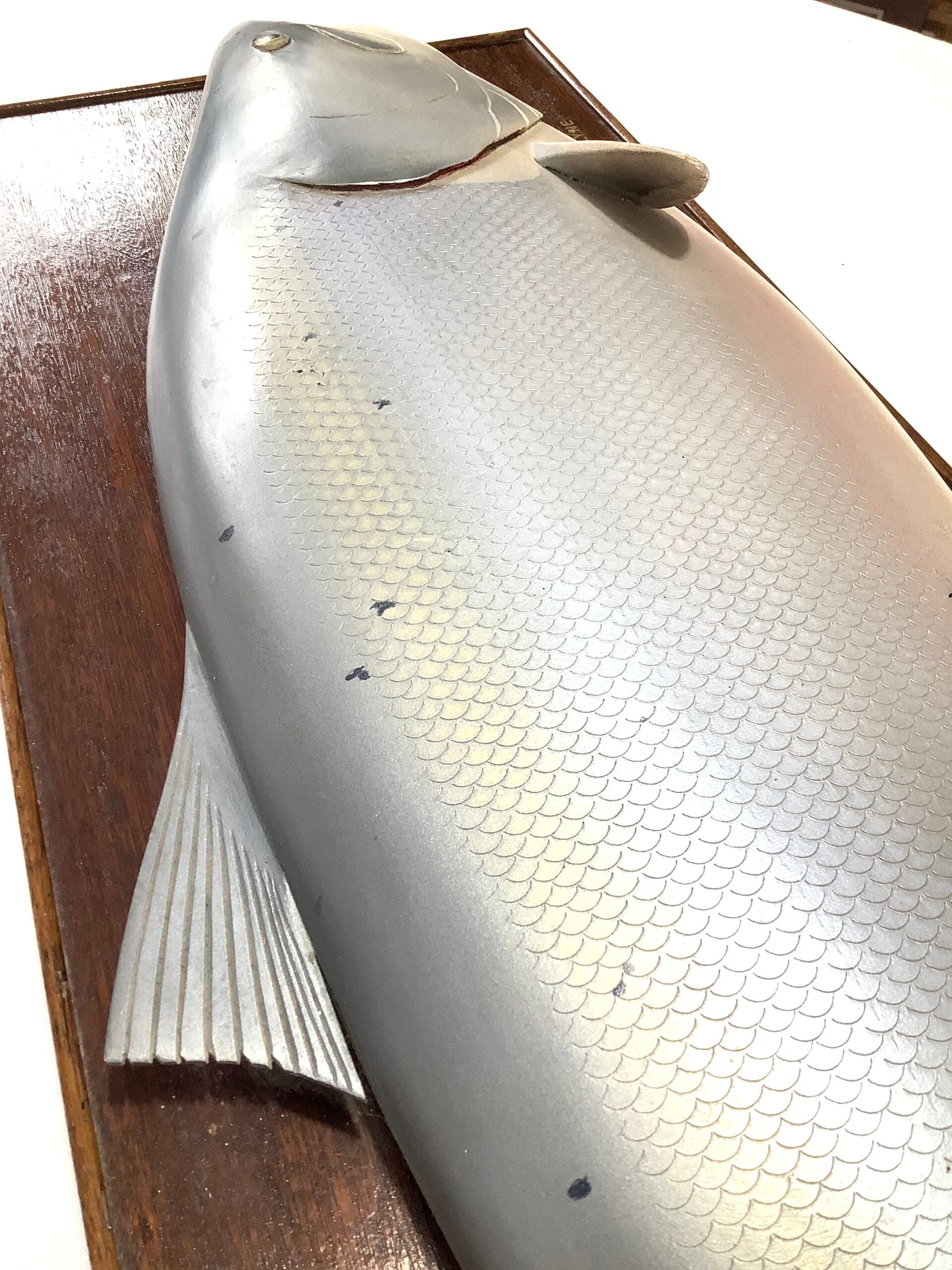 A Half Block Wood Carved Salmon on a Mahogany’s Display Board
