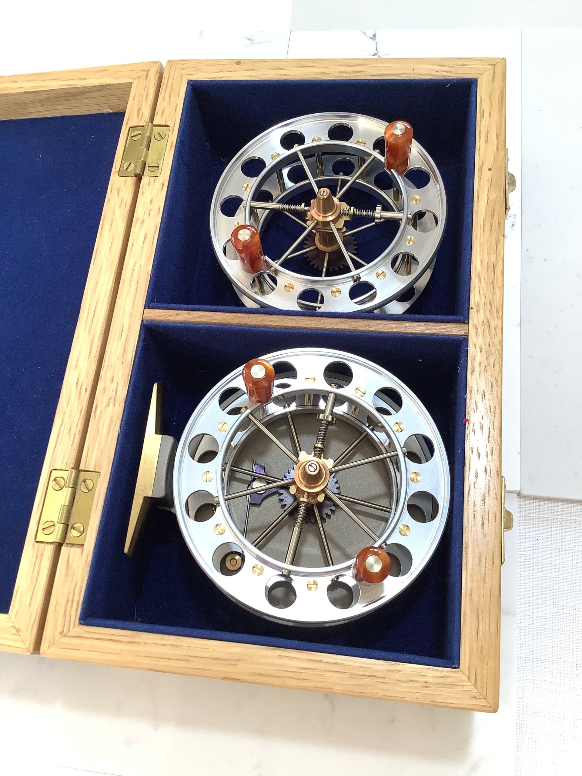 A presentation Boxed CHRIS LYHTE ROACH CENTREPIN WITH SPARE SPOOL