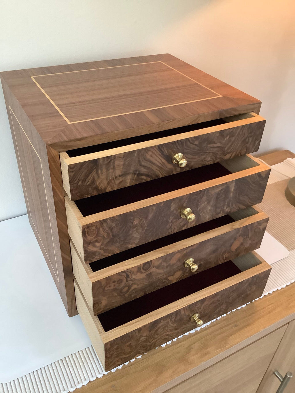 A bespoke hand crafted oak walnut veneered collectors cabinet