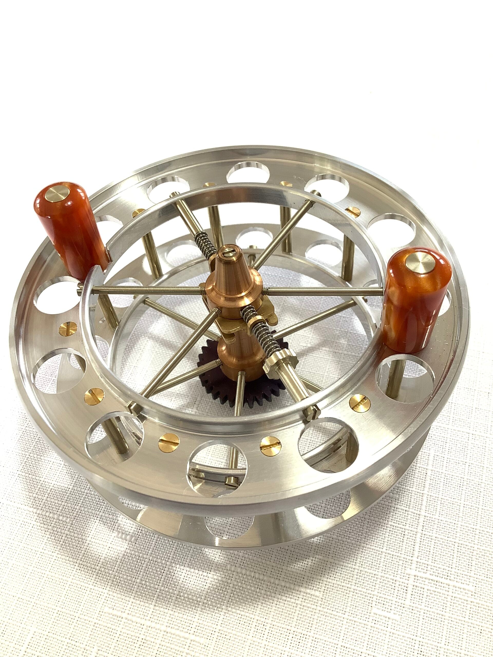 A presentation Boxed CHRIS LYHTE ROACH CENTREPIN WITH SPARE SPOOL
