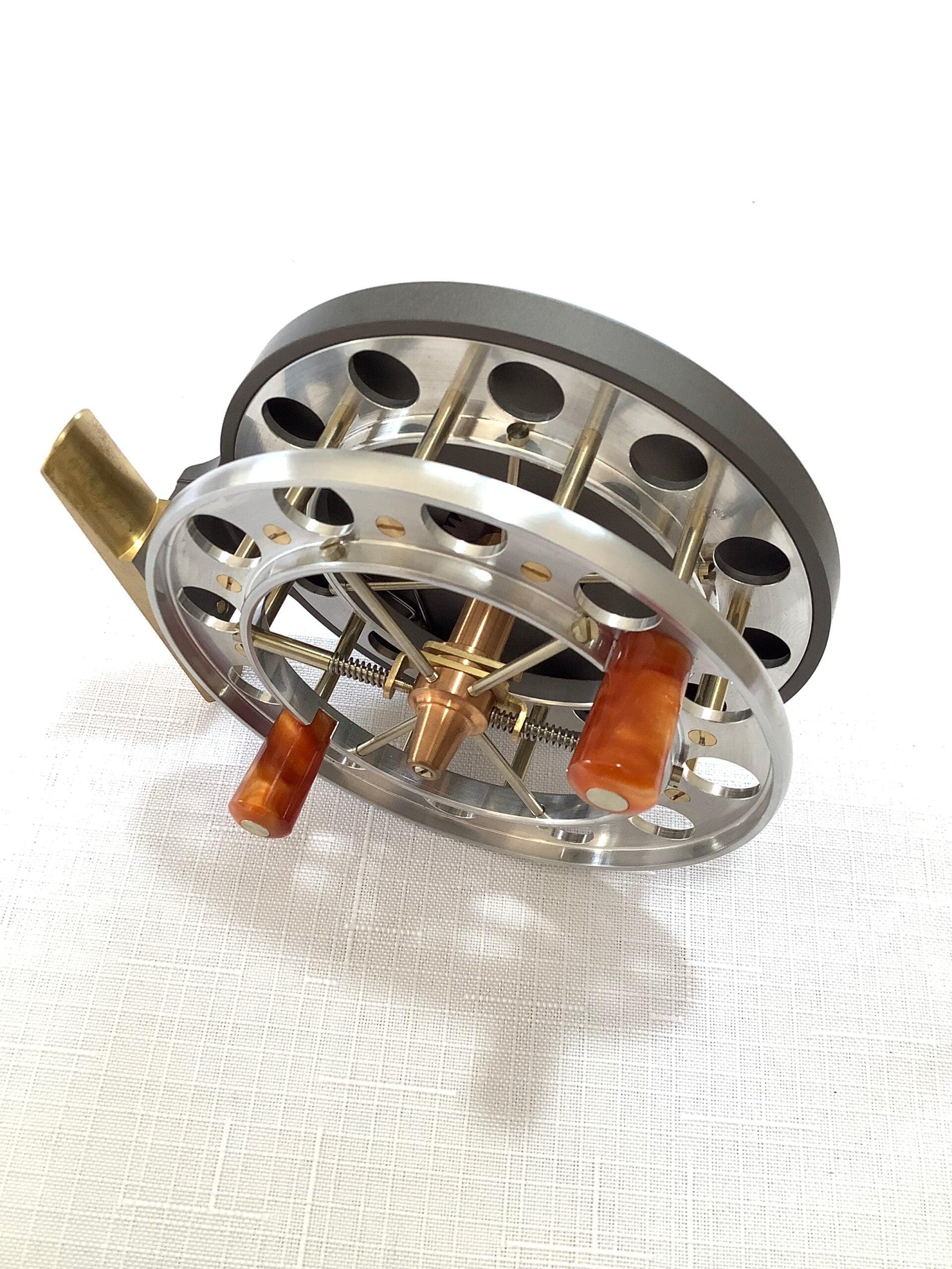 A presentation Boxed CHRIS LYHTE ROACH CENTREPIN WITH SPARE SPOOL