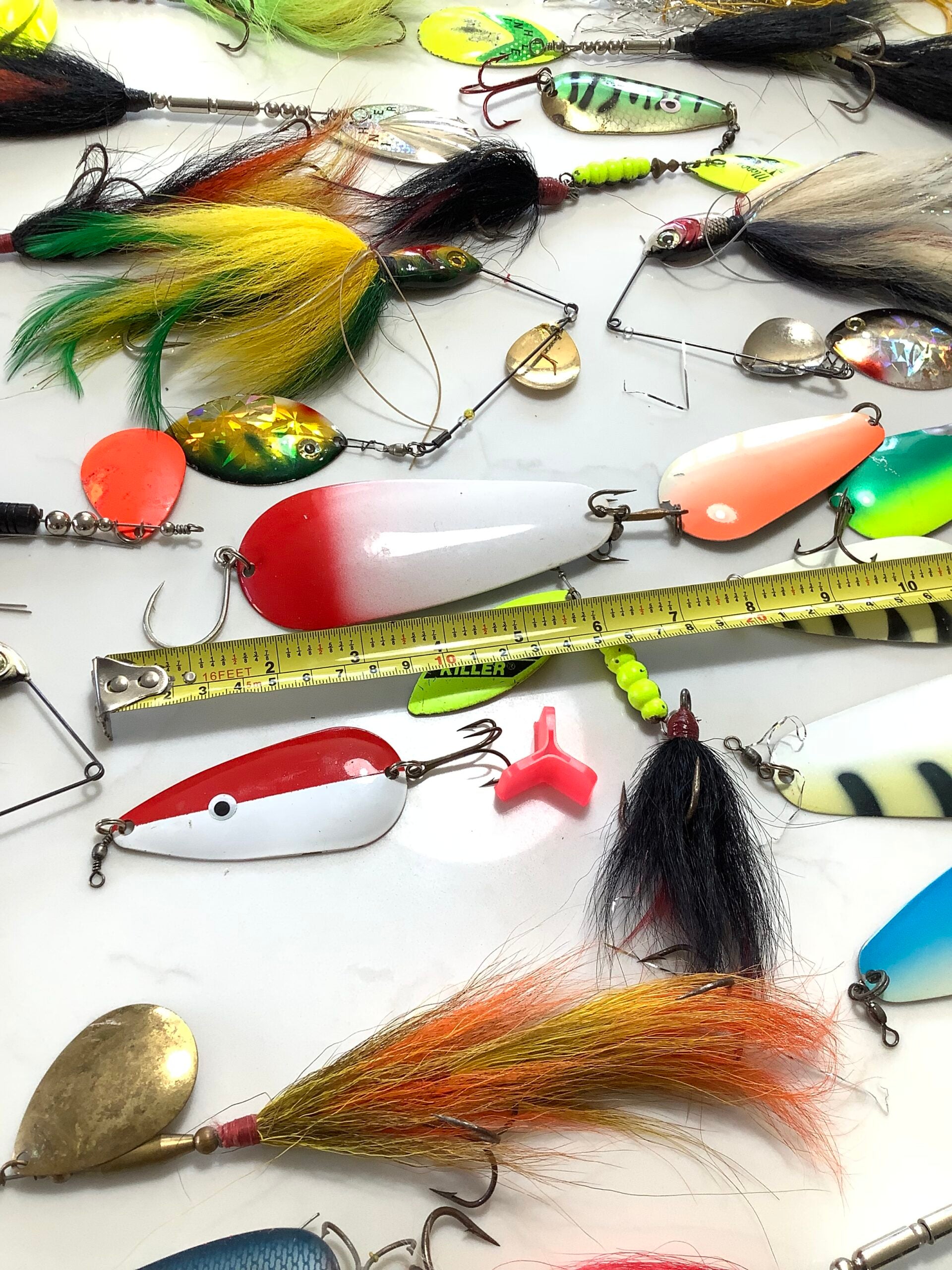 A selection of Large Pike spinners, spinnerbaits and bucktails, spoons, with box.