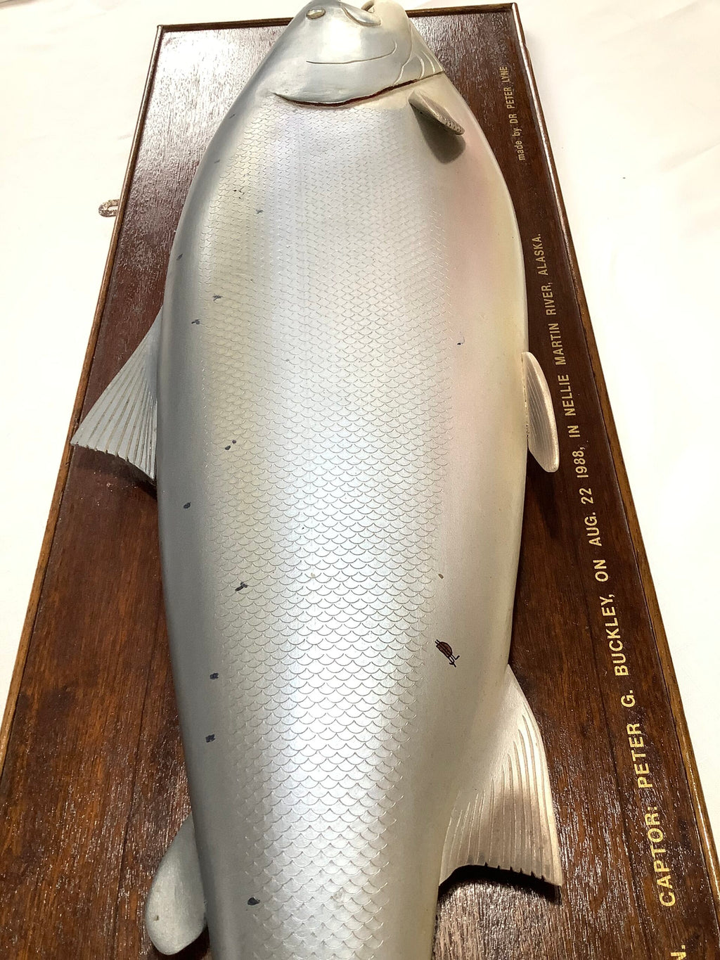 A Half Block Wood Carved Salmon on a Mahogany’s Display Board
